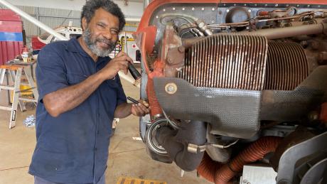 David Lamboa standing next to aircraft