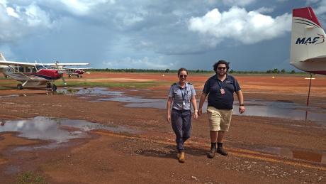 Pilot and ops officer walking to hangar