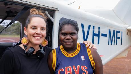 Teacher and Homeland Teacher in fromn to MAF aircraft