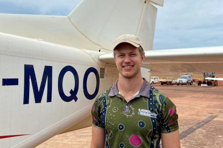 Man standing in front of plane