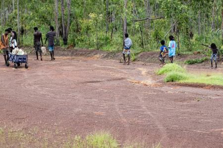 Yolngu folk walking back from the airstrip to their homeland.