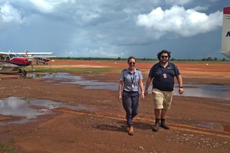 Pilot and ops officer walking to hangar
