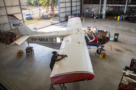 Engineer working on an aircraft in a hangar