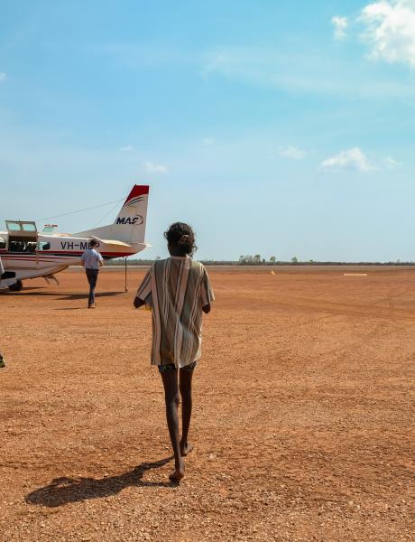 MAF plane, pilot, and passengers on tarmac