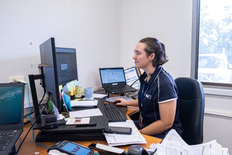 Resrvations officer at work at desk