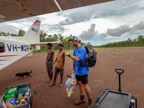 Teacher meets locals at airstrip