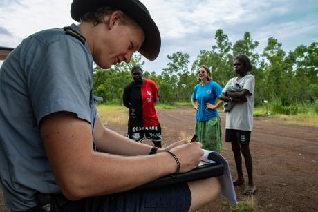 Pilot completes paperwork at airstrip
