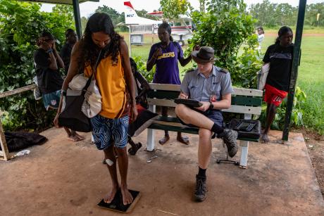 Studetn being weighed for flight