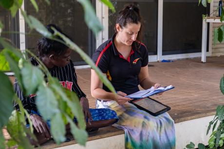 Agency staff and client on verandah