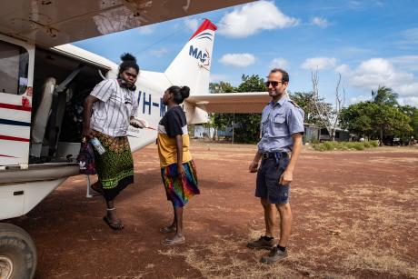 Student teachers and MAF pilot at plane