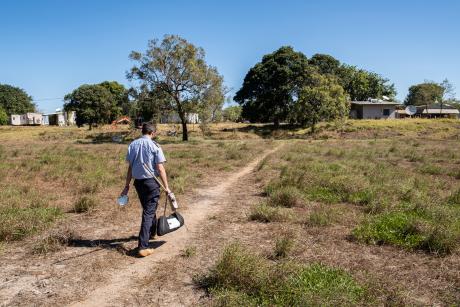 Pilot hand-delivering items to clinic