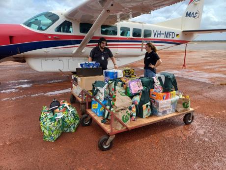 Two MAF staff loading aircraft