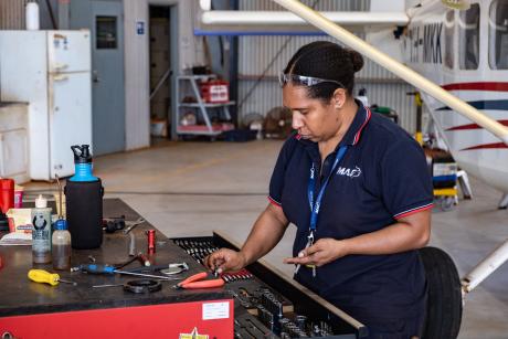 Engineer returning tools to tool box